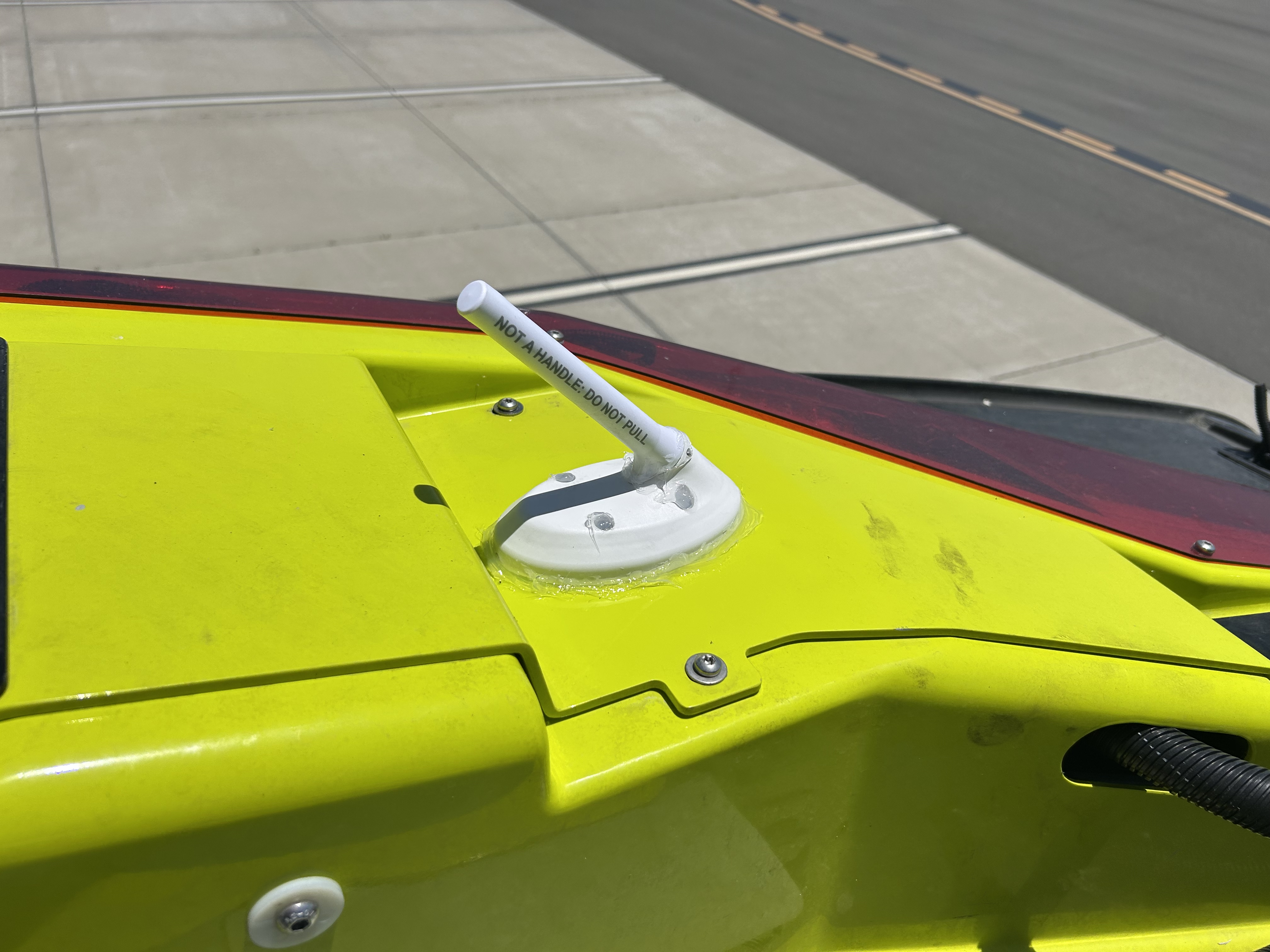 uAvionix VTU-20 antenna installed on a yellow airport vehicle roof.